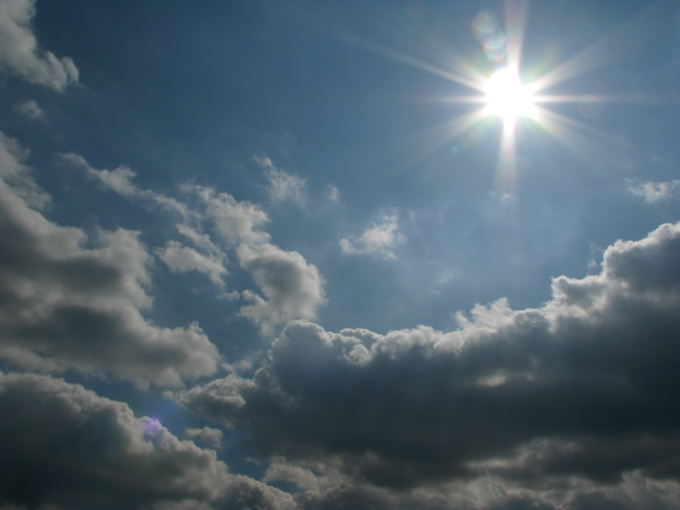 cloudy sky with blazing sun